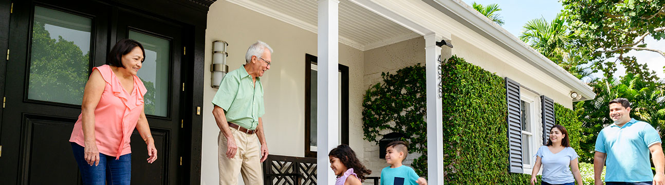 Grandparents-welcoming-grandkids-on-their-porch